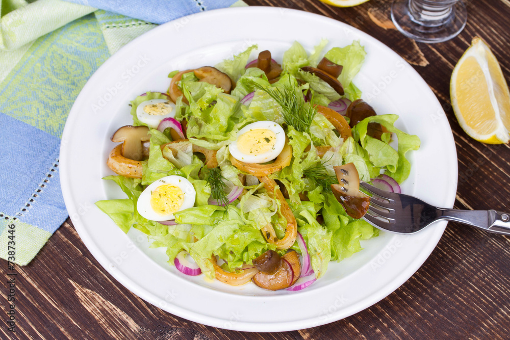 Fresh salad with mushrooms, squid and quail eggs Fresh salad with mushrooms, squid and quail eggs