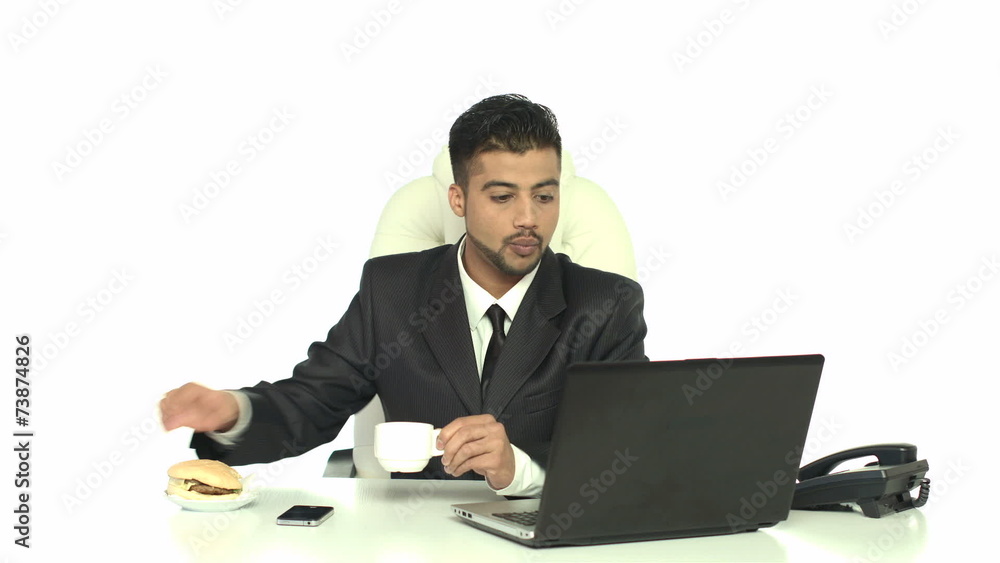 The indian businessman has lunch in the office The indian businessman has lunch in the office