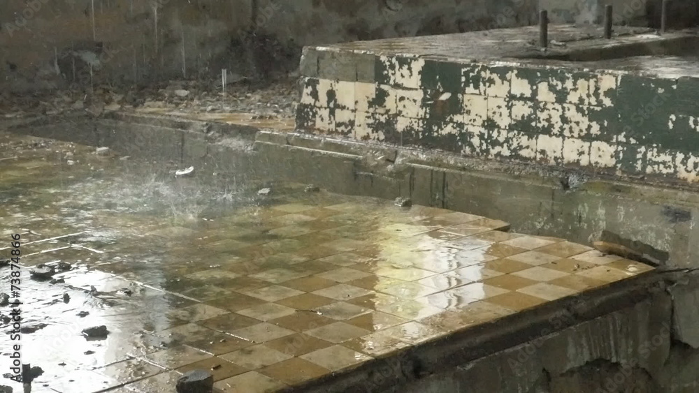 Abandoned factory ruins in raining day , leaking water