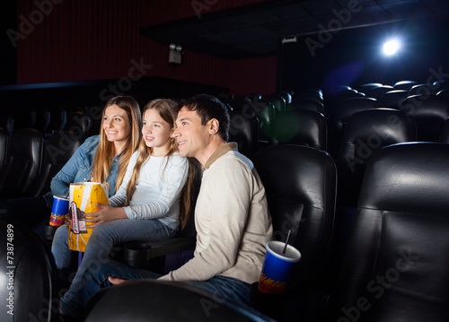 Family Watching Film In Cinema Theater
