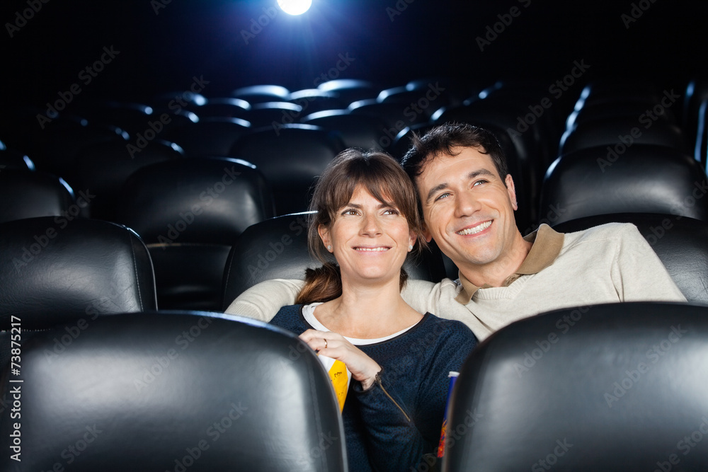 Fototapeta premium Happy Couple Watching Film In Theater