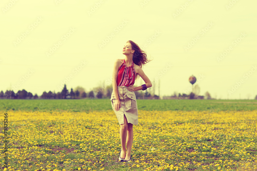 beautiful young girl in a field of flowers beautiful young girl in a field of flowers