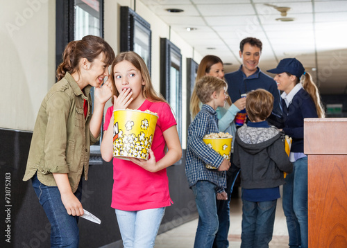 Girls Gossiping At Cinema photo