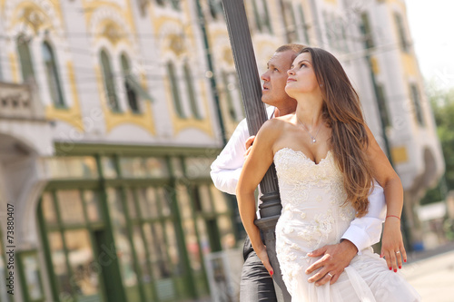 Beautiful bride and groom in the city sunny day © hreniuca