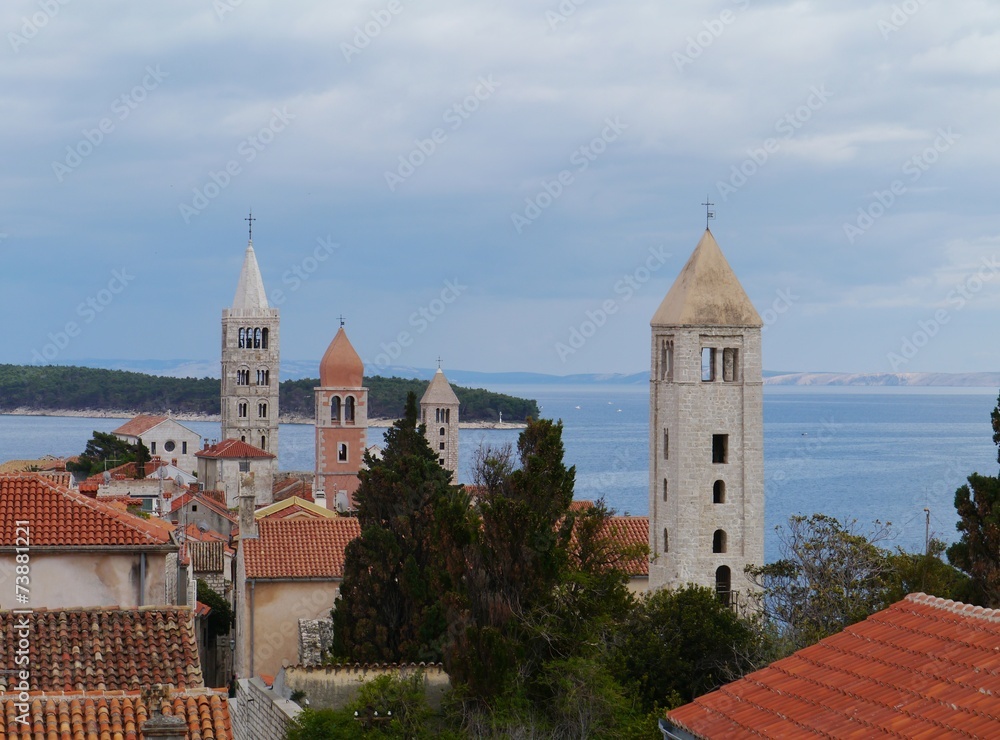 The four church towers of the city Rab in Croatia