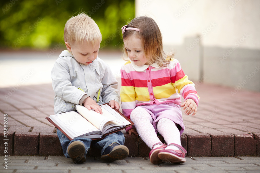 funny boy and girl reading book funny boy and girl reading book
