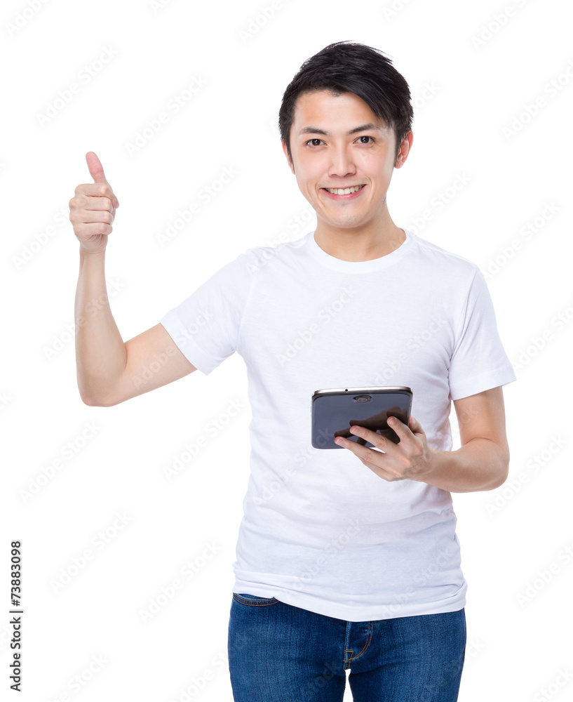 Asian man use of tablet and thumb up Asian man use of tablet and thumb up