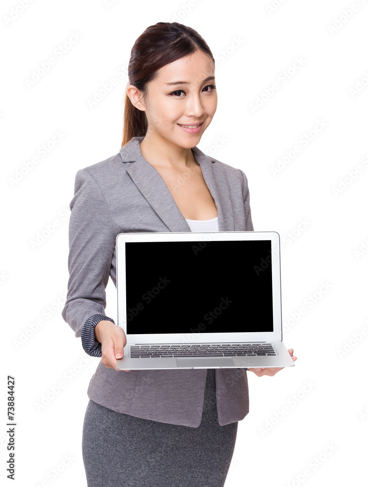 Businesswoman show with blank screen of laptop computer Businesswoman show with blank screen of laptop computer