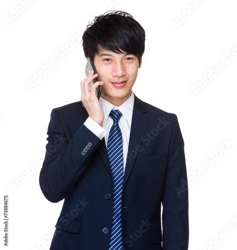 Businessman tale to cellphone