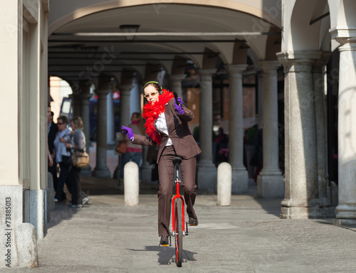 portrait of businesswoman with unicycle