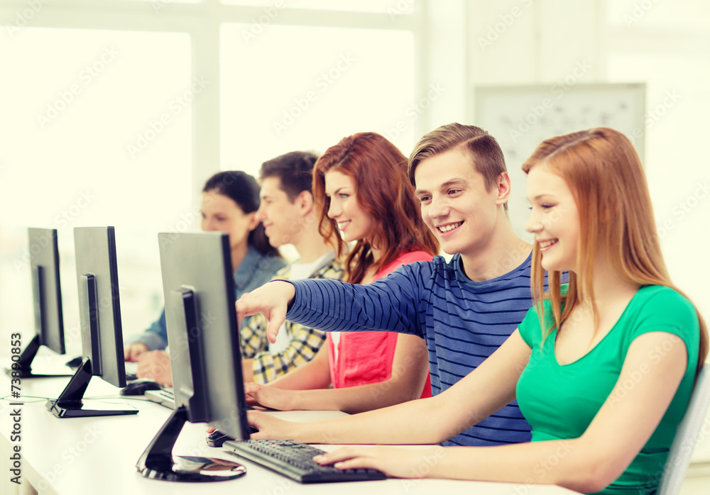 female student with classmates in computer class female student with classmates in computer class