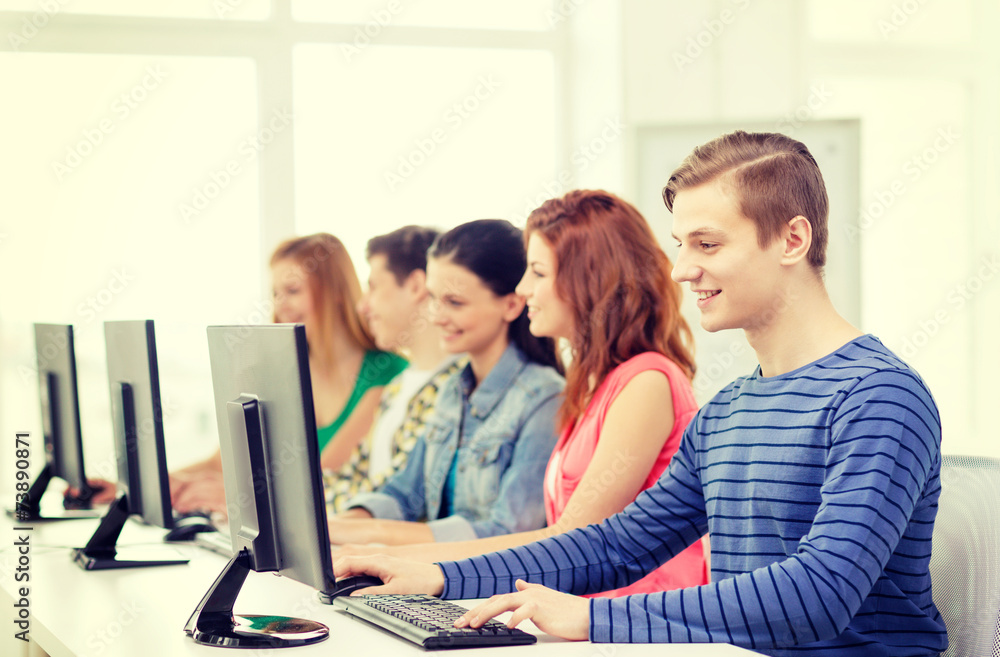 male student with classmates in computer class male student with classmates in computer class
