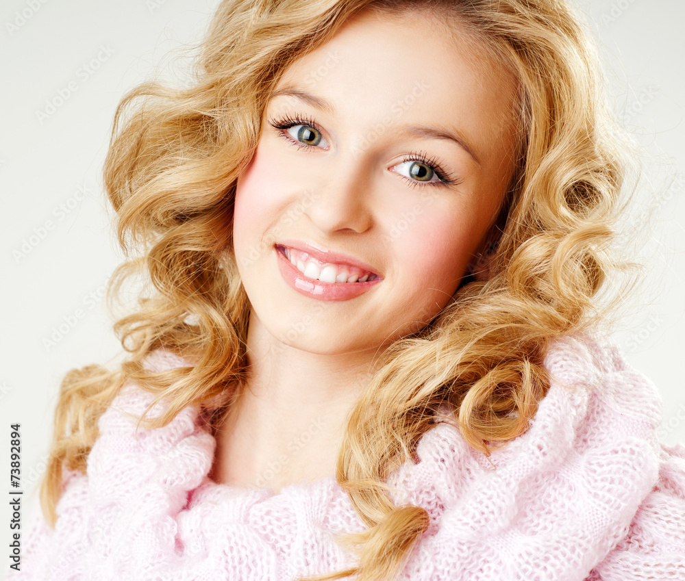 cheerful blond woman in a pink sweater. the winter season. cheerful blond woman in a pink sweater. the winter season.