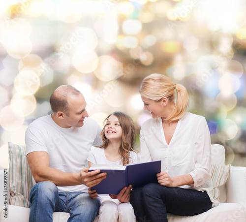 happy family with book at home