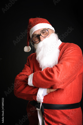 xmas man with red santa claus dress looking down thinking