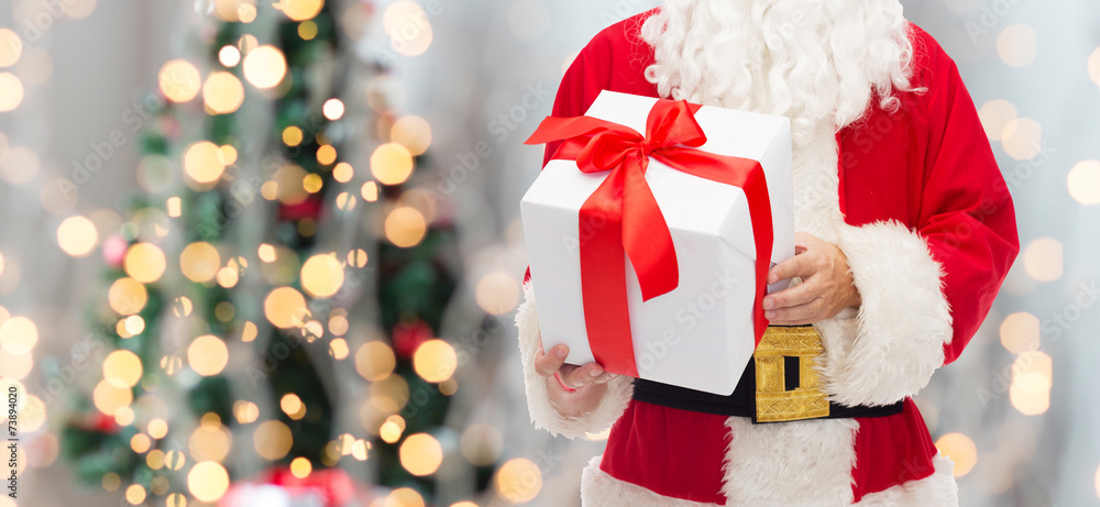 man in costume of santa claus with gift box man in costume of santa claus with gift box