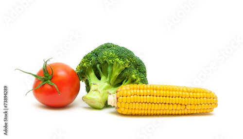 corn  broccoli and ripe tomatoes isolated on white background