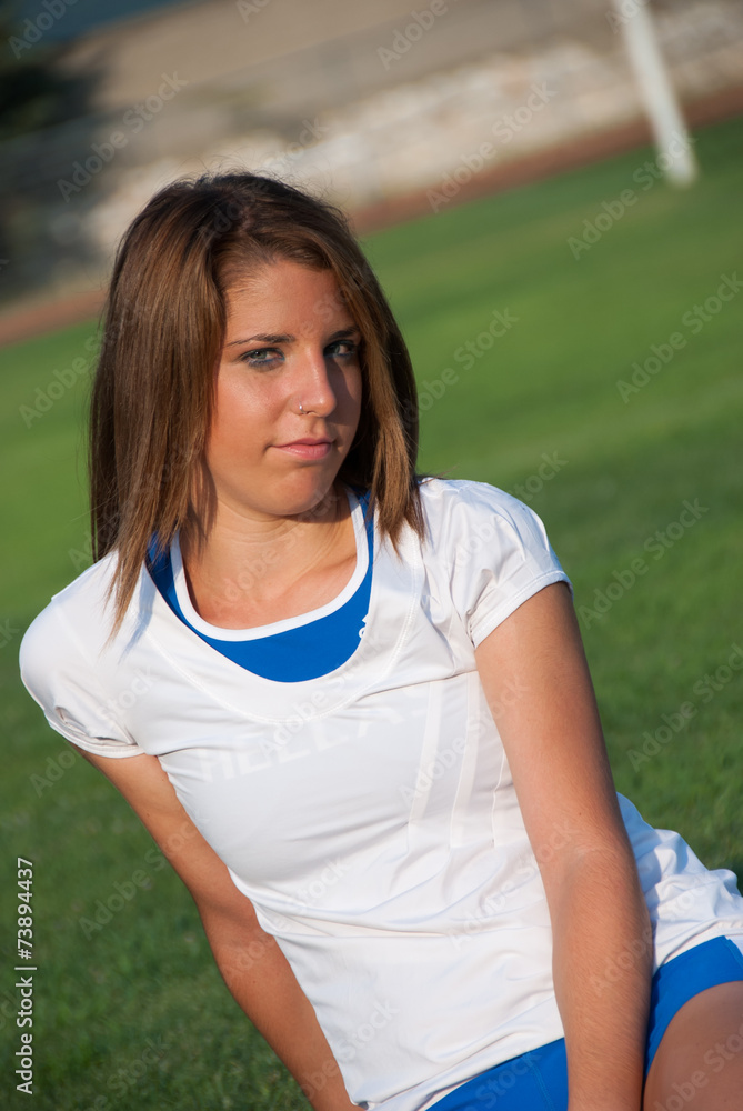 Female sport girl runner stretching before workout Female sport girl runner stretching before workout