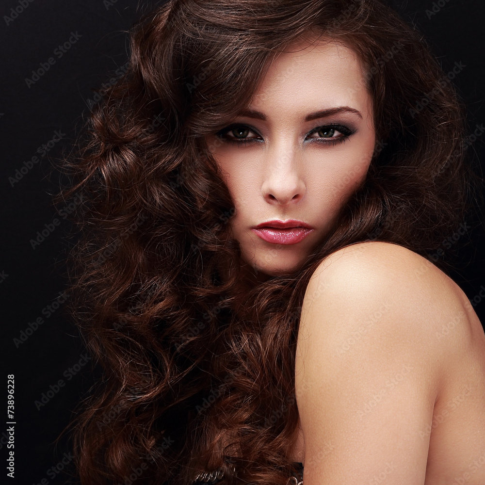 Fototapeta premium Sexy bright makeup female model with brown curly hair