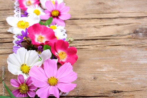 Fototapeta Naklejka Na Ścianę i Meble -  Table decoration with cosmos, roses and other flowers