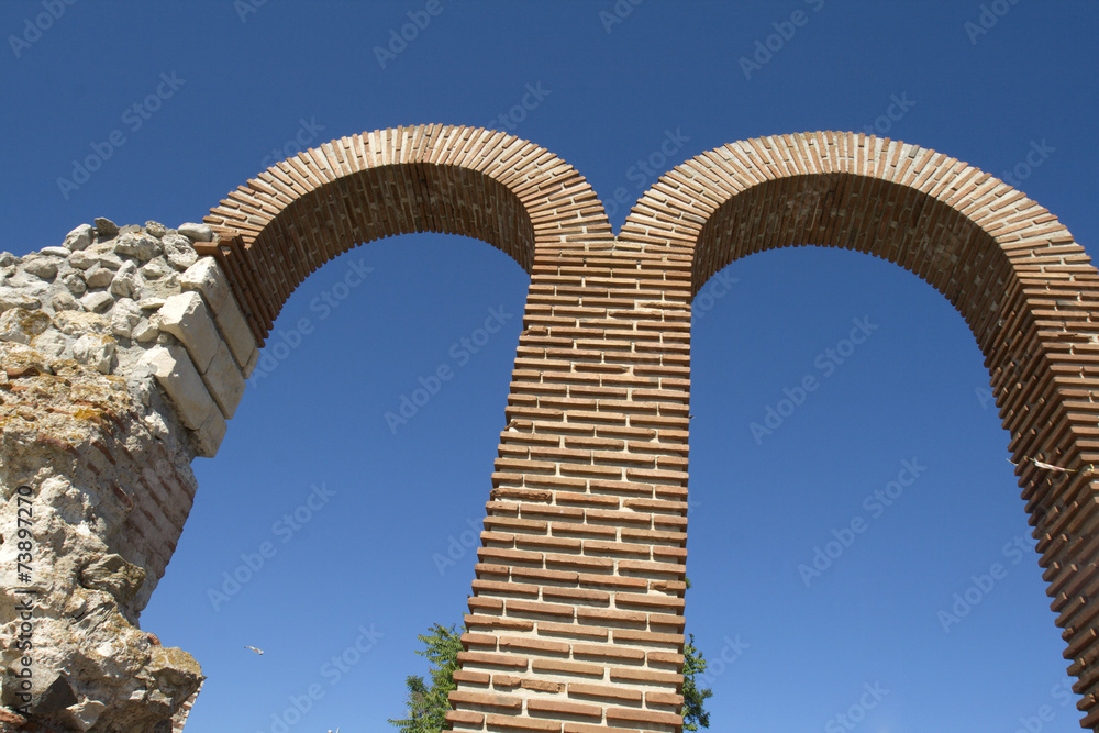 Two high brick semicircular arches