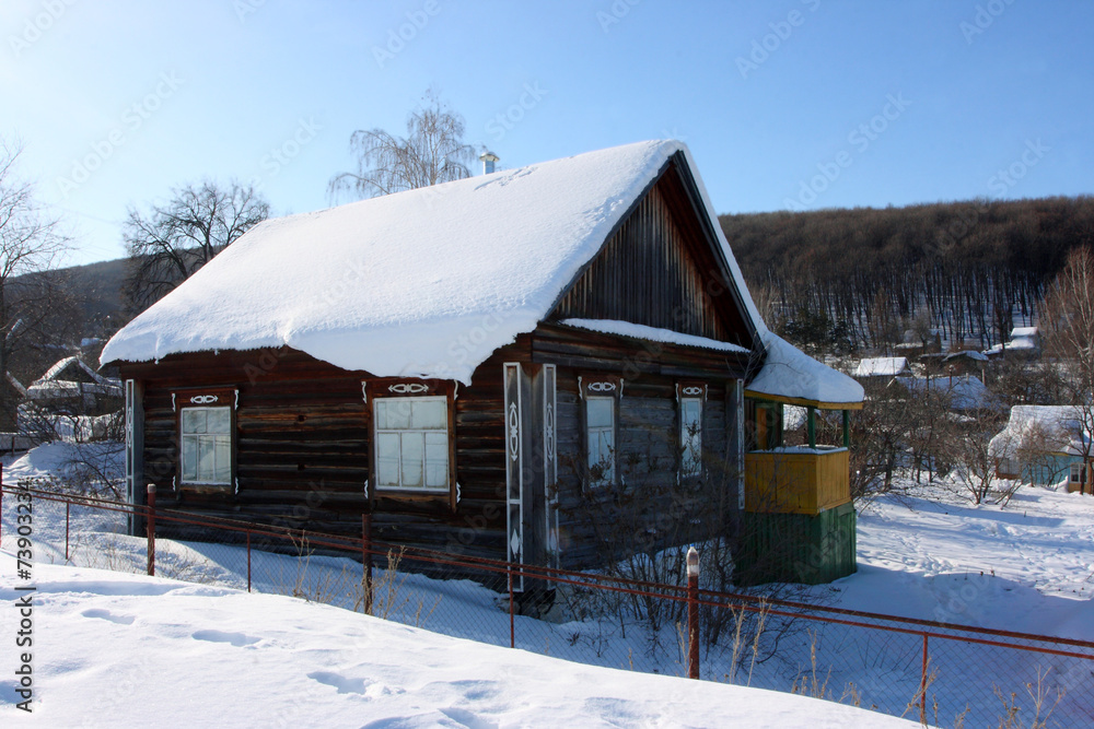 Blockhouse against a blue sky in the winter