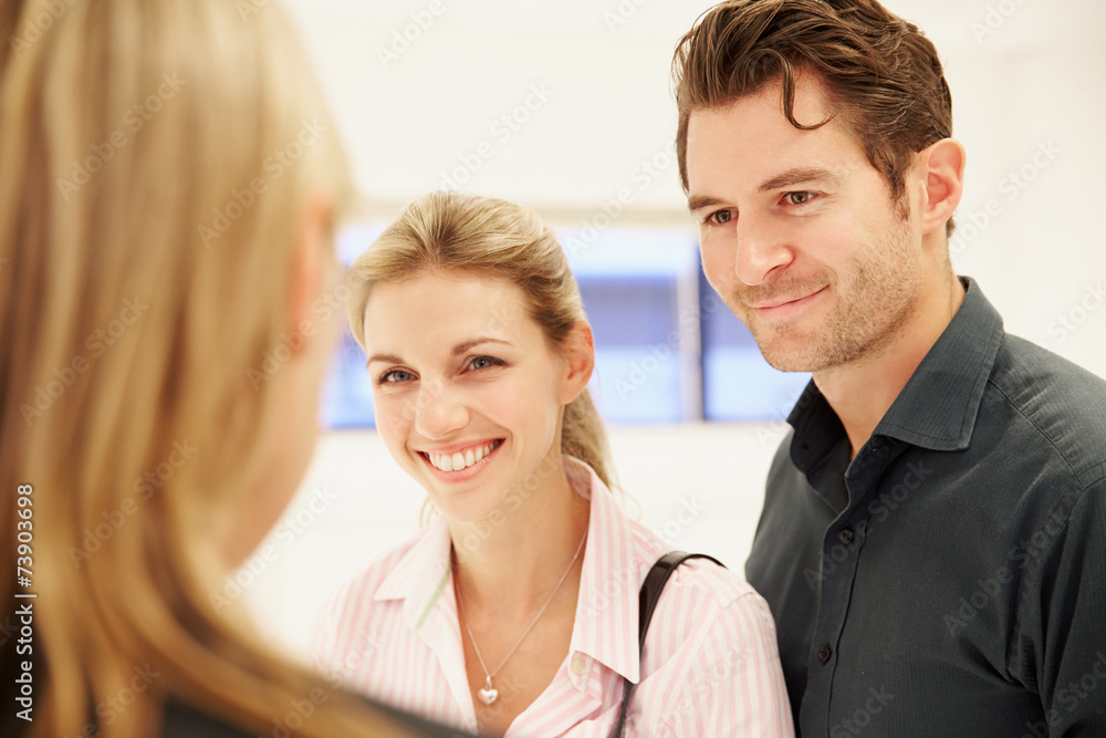 Estate Agent Showing Empty Office Space To Clients Estate Agent Showing Empty Office Space To Clients