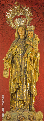 Seville - carved polychrome statue of Madonna in San Roque
