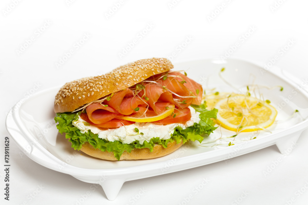 Cream cheese and smoked salmon bagel. Selective focus. Cream cheese and smoked salmon bagel. Selective focus.