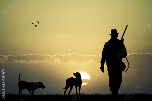 Fototapete Jäger bei Sonnenuntergang