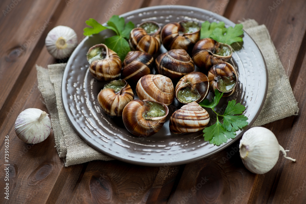 Ceramic plate with escargots de Bourgogne, garlic and parsley Ceramic plate with escargots de Bourgogne, garlic and parsley
