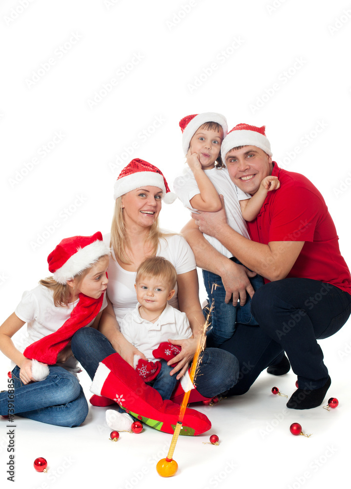 Happy cute family in santa's hats Happy cute family in santa's hats