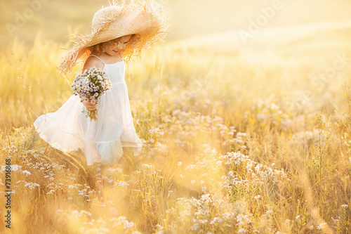 Little girl with a bouquet of wild flowers