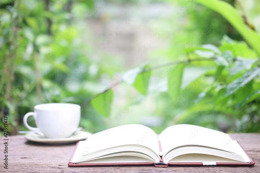Notebook and coffee on wooden table Notebook and coffee on wooden table