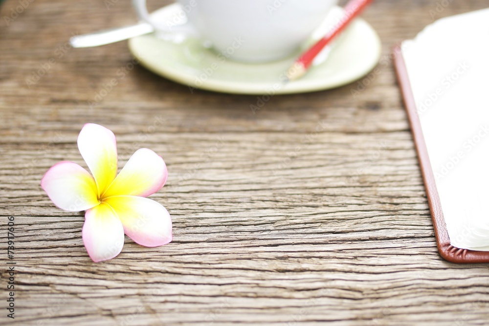 Notebook and coffee on wooden table Notebook and coffee on wooden table