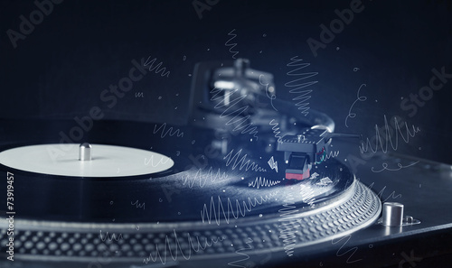 Turntable playing music with hand drawn cross lines