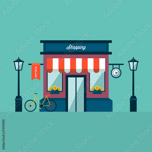 Shop building with bicycle and lamps