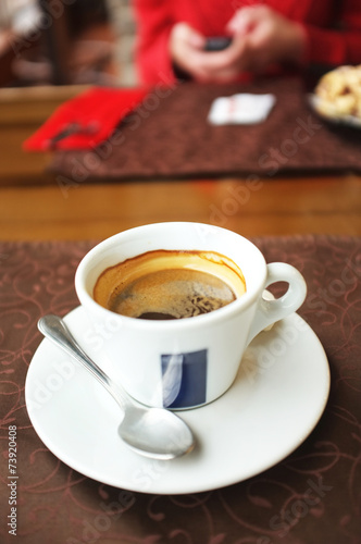 Cup of tasty coffee in cafe