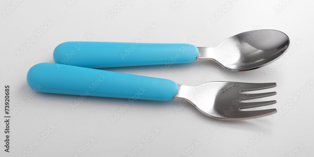 Blue baby cutlery isolated on white Blue baby cutlery isolated on white