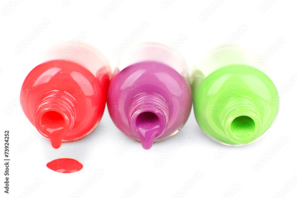 Colorful nail polishes, isolated on white