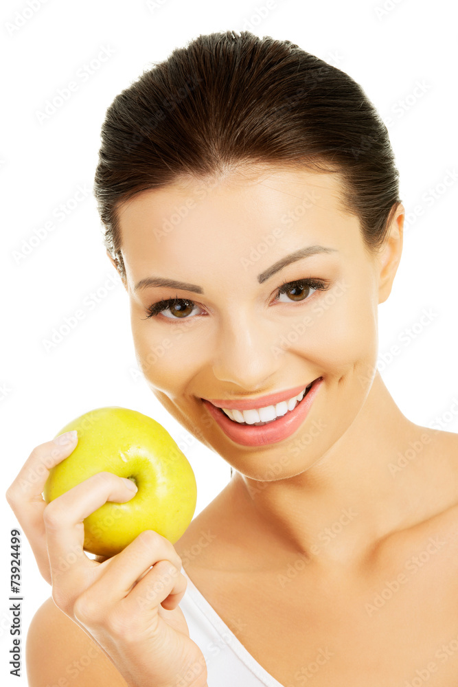 Smiling beauty holding green apple Smiling beauty holding green apple