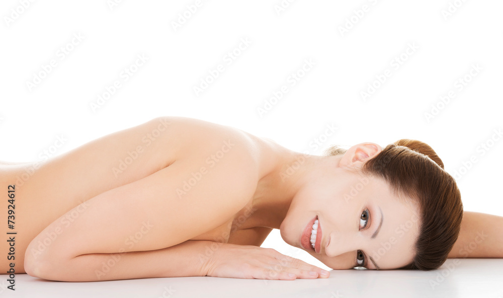 Portrait of naked woman lying on belly Portrait of naked woman lying on belly