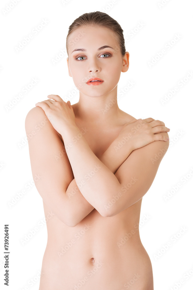 Fototapeta premium Sensual portrait of nude woman covering breast