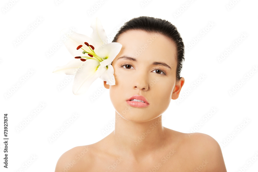 Fototapeta premium Nude woman with a lily flower