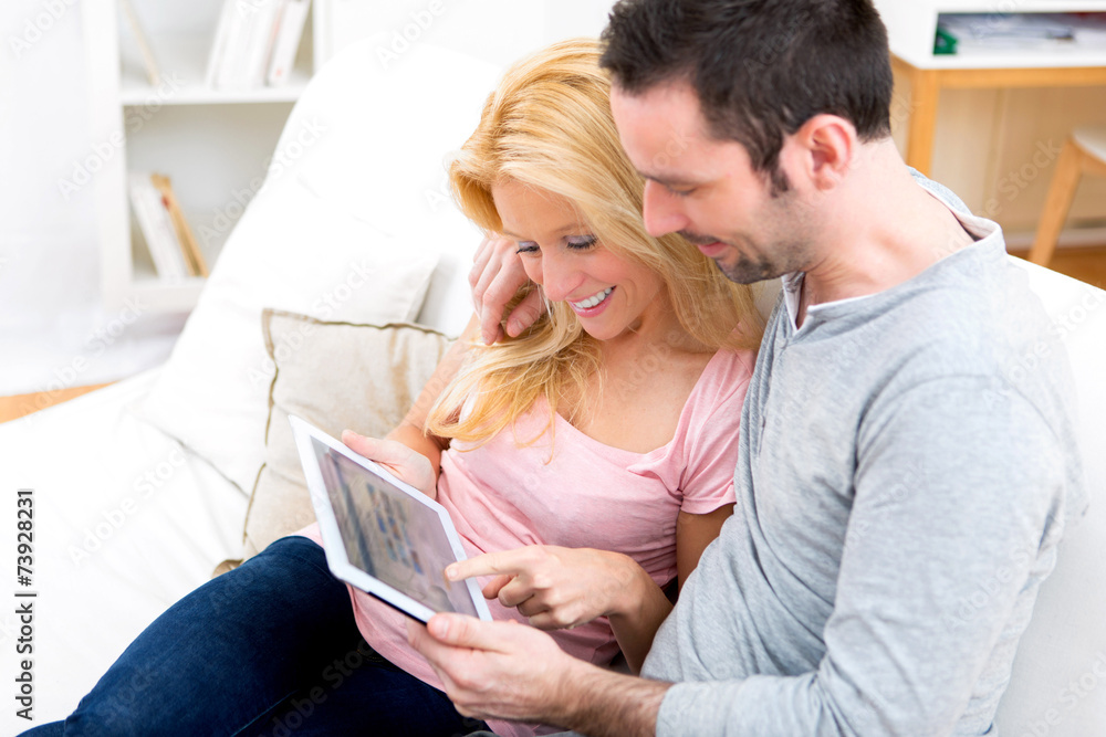 Young attractive couple surfing on internet Young attractive couple surfing on internet