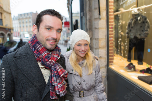 Young attractive couple doing some window shopping