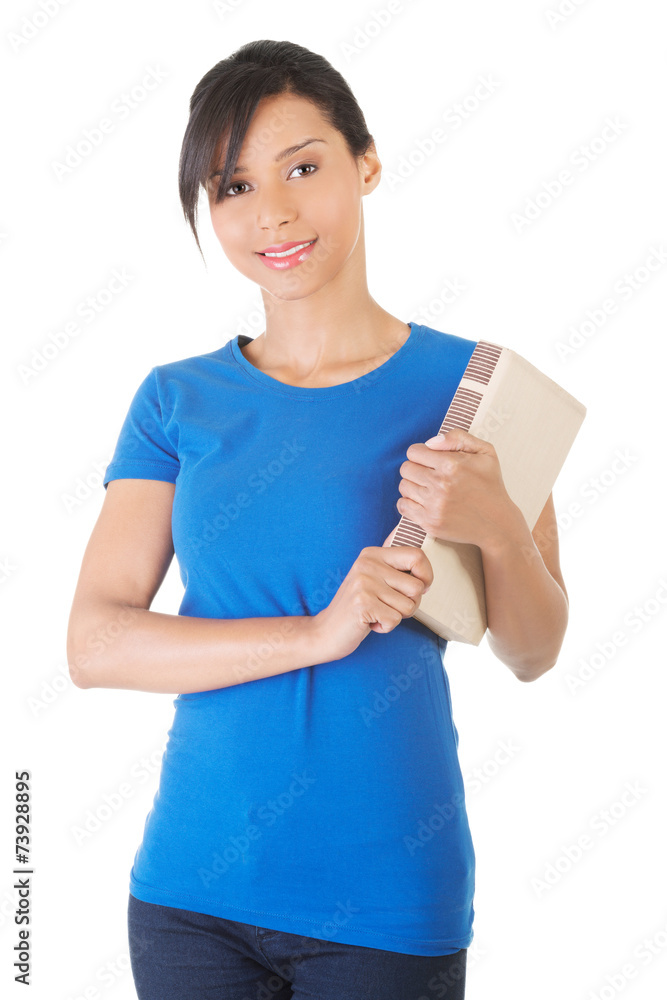 Young beautiful student holding a book Young beautiful student holding a book