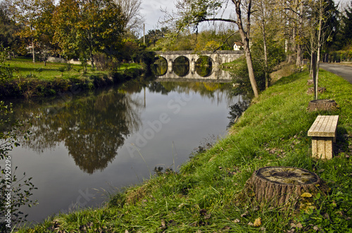 Le Luy de Béarn river and the old city bridge of  Sault-de-Nava photo