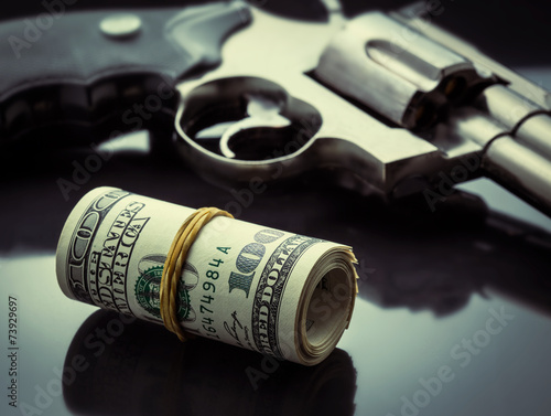 Gun and money concept
