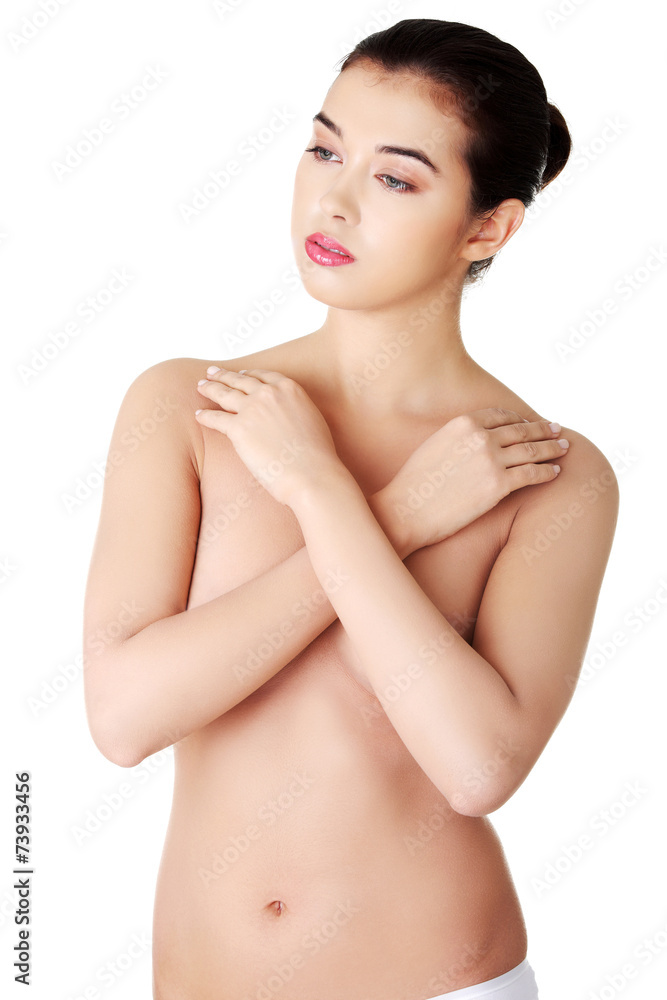 Sensual portrait of a nude woman with arms crossed Sensual portrait of a nude woman with arms crossed